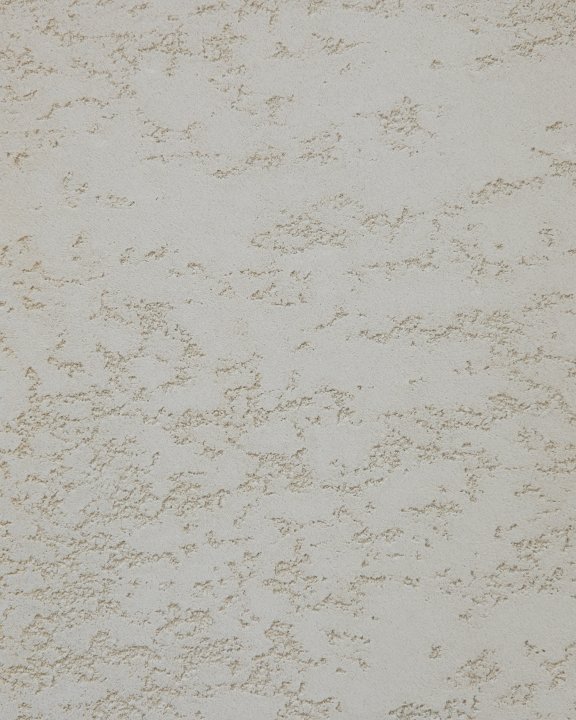 Close-up of a white microcement wall with visible trowel marks.