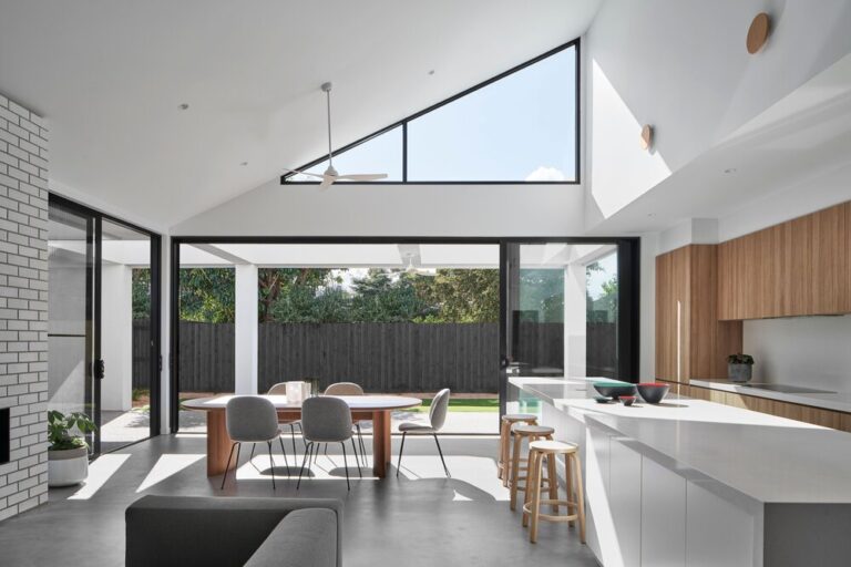 Modern kitchen and dining area with large window and xbond microcement floors